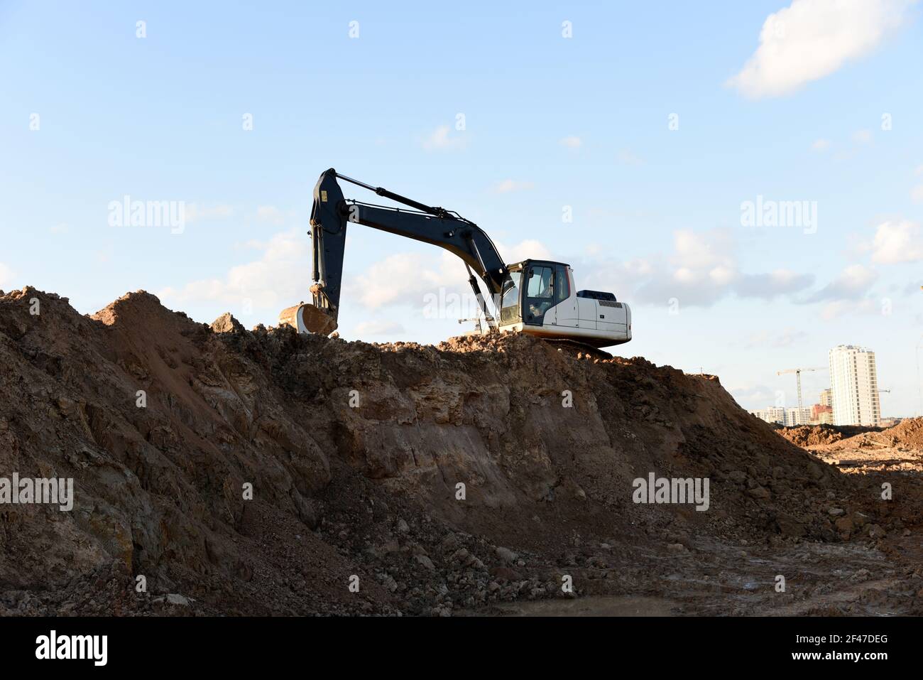 Excavator dig the trenches at a construction site. Trench for laying