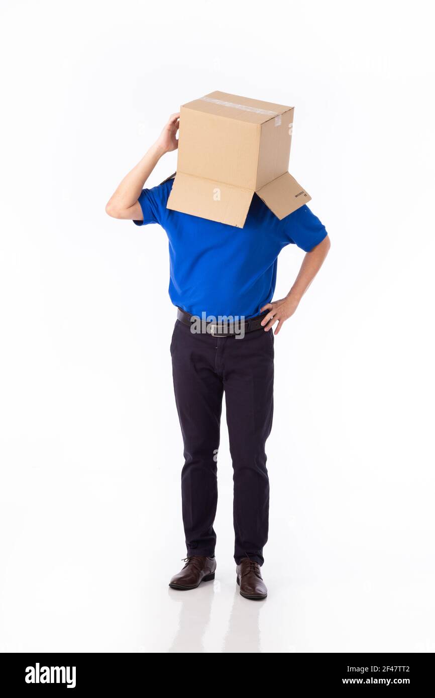 man in a bluer T-shirt with a cardboard box on his head makes a gesture ...