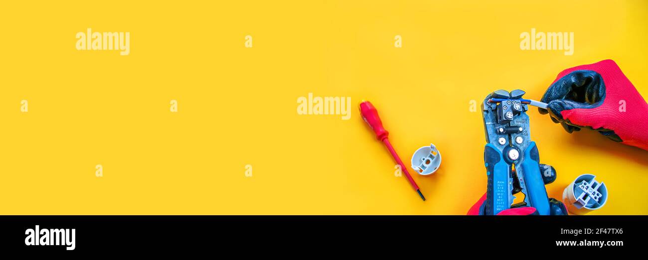 Electrical installation measuring instruments tools on a yellow background with copy space. place for text. Selective focus Stock Photo