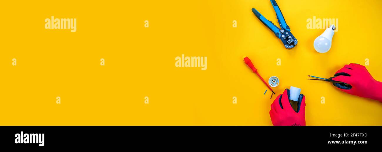 Electrical installation measuring instruments tools on a yellow background with copy space. place for text. Selective focus Stock Photo