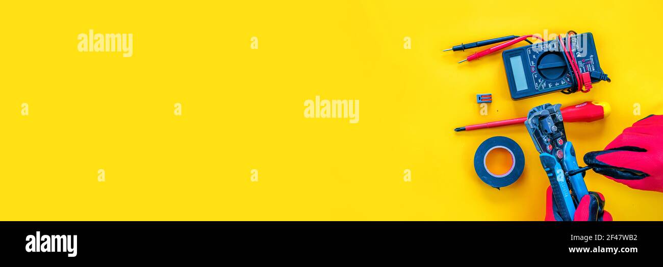 Electrical installation measuring instruments tools on a yellow background with copy space. place for text. Stock Photo