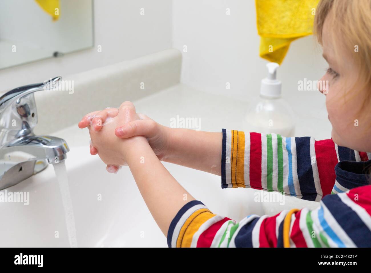 Little child washing hands with soap in the bashroom Stock Photo - Alamy