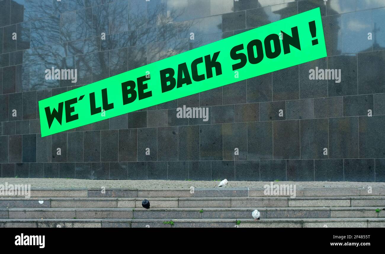 Anouncement of reopening and restarting business on outdoor public placard, coronavirus lockdown concept Stock Photo