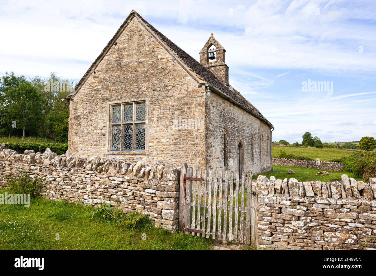 The 13th century church of St Oswald, now isolated, standing on the edge of a deserted medieval village at Widford, Oxfordshire UK Stock Photo