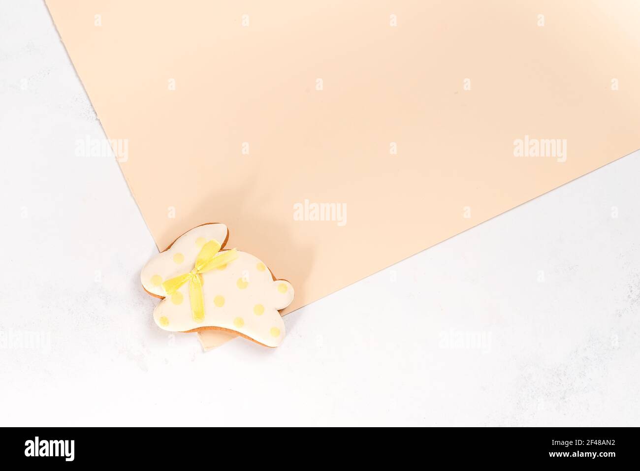 Easter bunny cookies on a double beige background Stock Photo