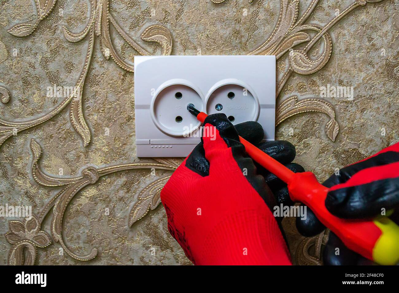 Man checking wall socket electric current hi-res stock photography and ...