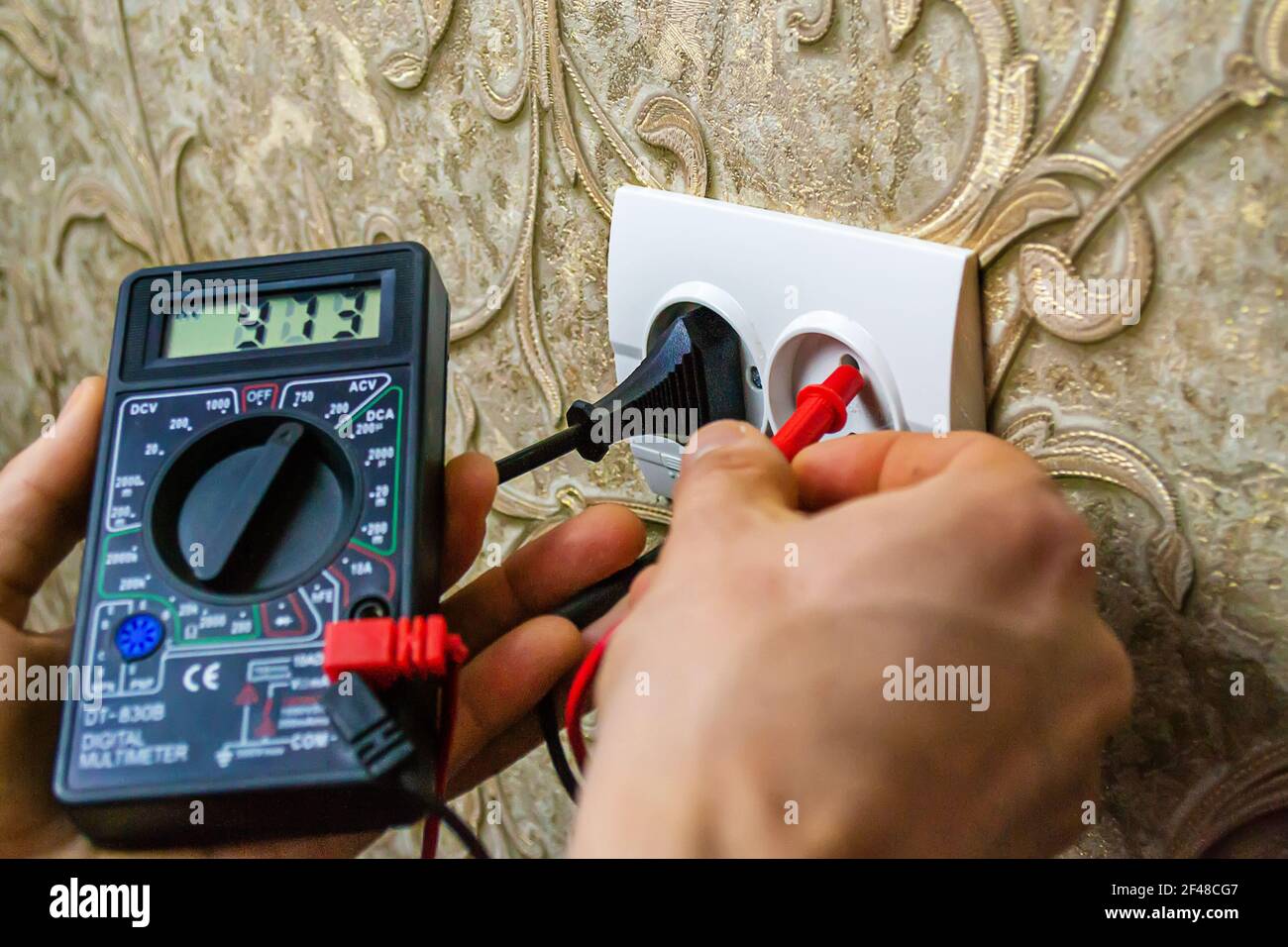 Repair of the socket, socket. Tools, voltage measuring devices. selective focus. Stock Photo