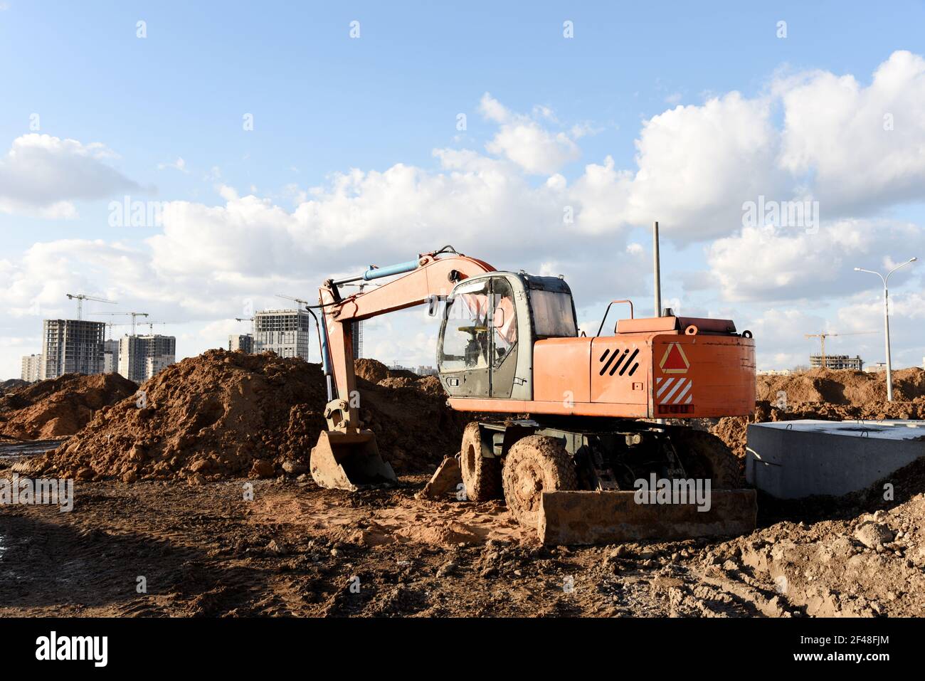 Excavator dig the trenches at a construction site. Trench for laying ...