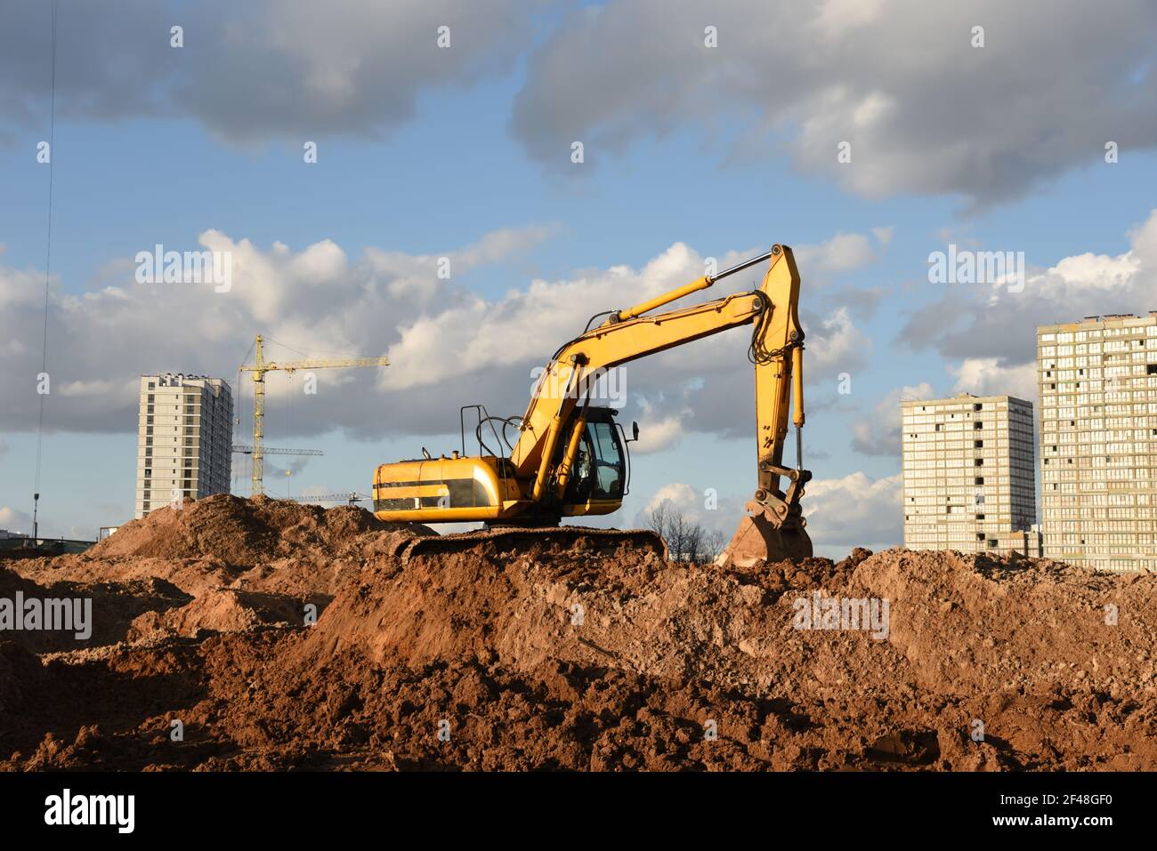 Excavator dig the trenches at a construction site. Trench for laying