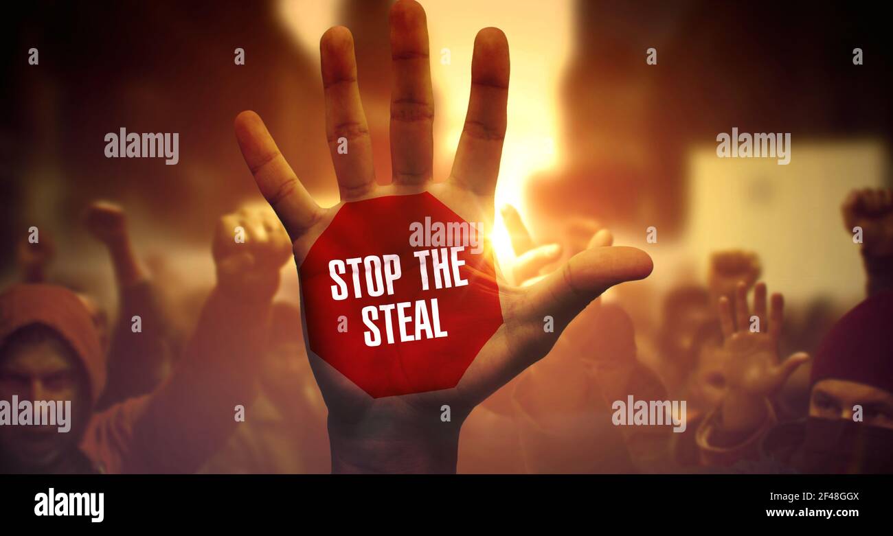 Stop The Steal. Social Activists Protesting and Fighting for Their Rights. Close View on Raised Hand. Crowd of Diverse People on Loud Demonstration. Stop The Steal Written on Raised Hand. Stock Photo
