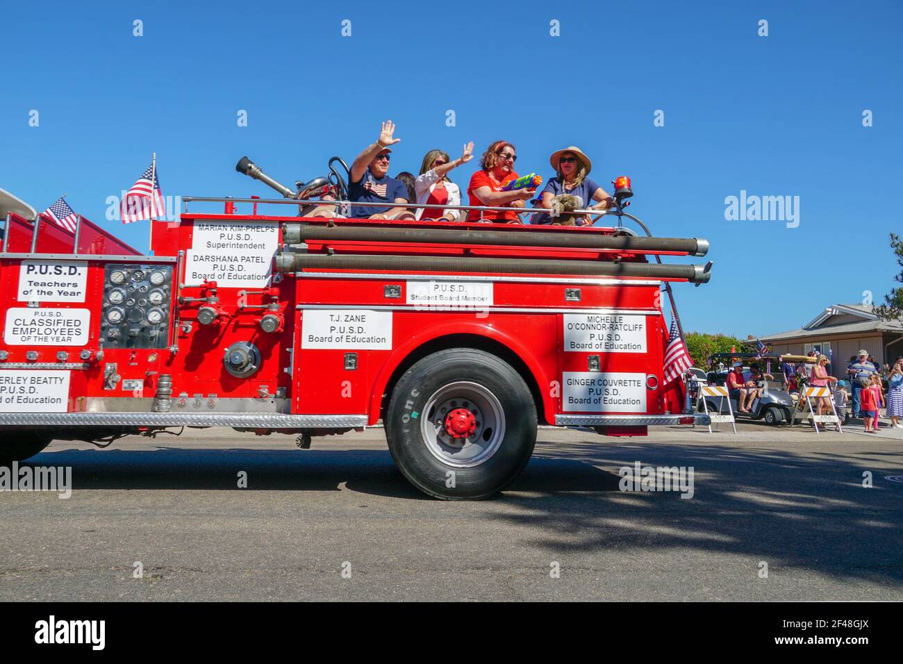 Old Firetruck and people at the July 4th Independence Day Parade in