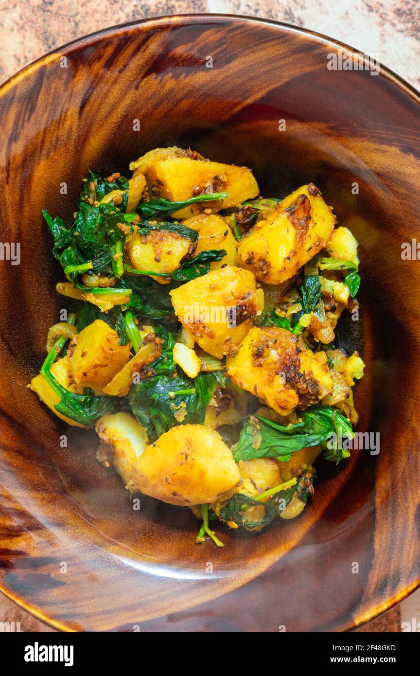 Indian saag aloo, potato and greens curry dish Stock Photo Alamy