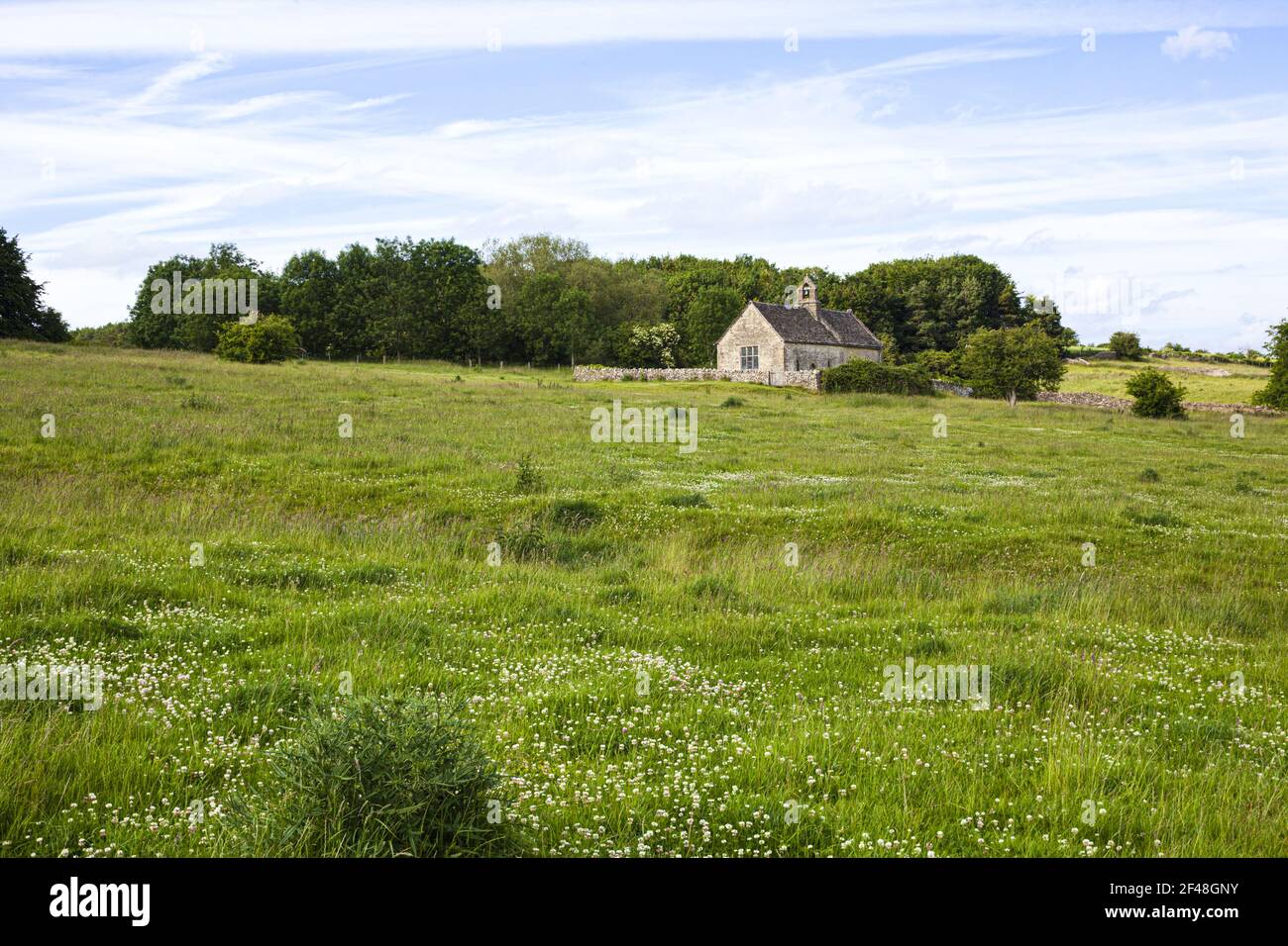 The 13th century church of St Oswald, now isolated, standing on the edge of a deserted medieval village at Widford, Oxfordshire UK Stock Photo