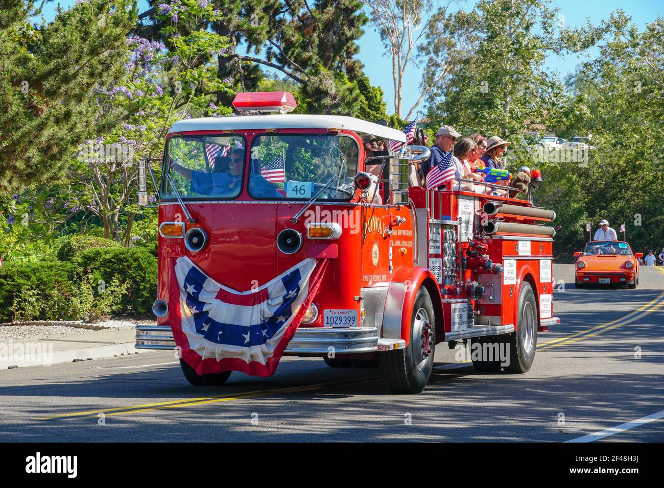 Old Firetruck and people at the July 4th Independence Day Parade in