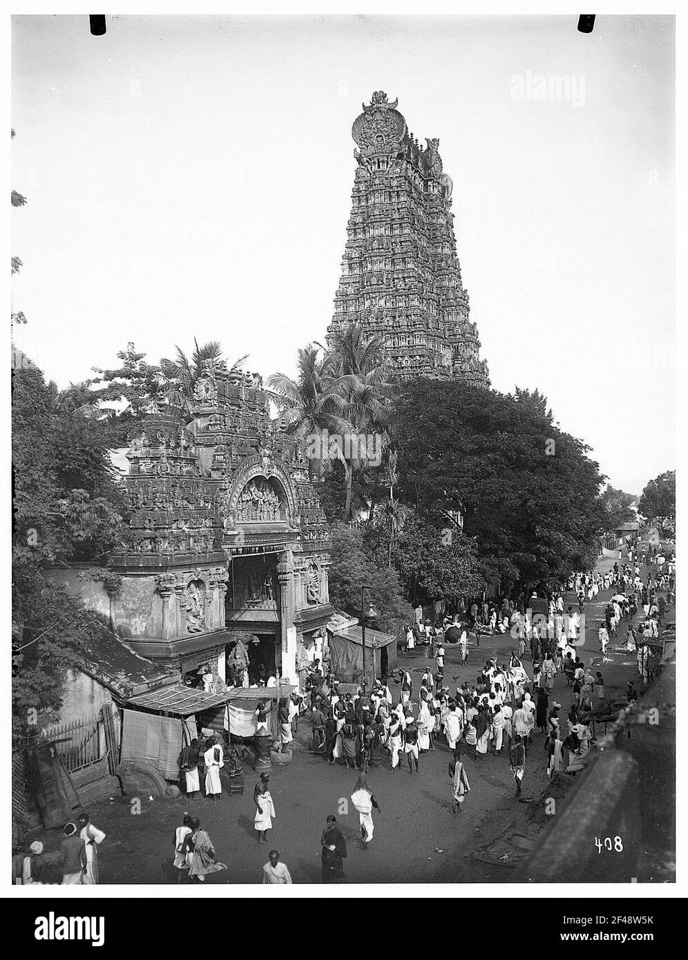 Madurai, India. Street scene in front of a temple gate at the Madurai
