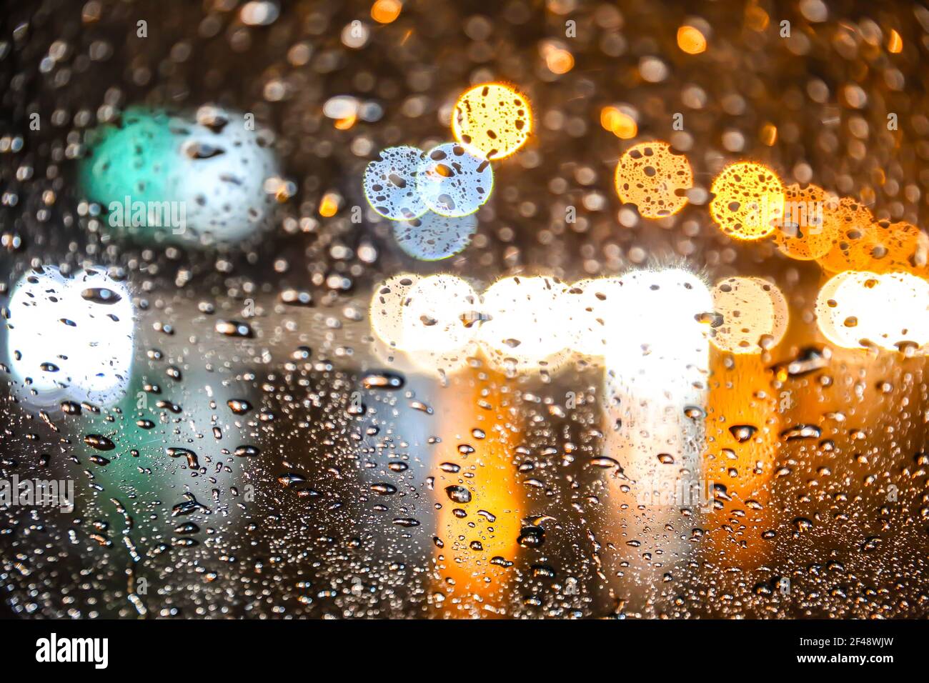view from the blurred car traffic on a wet road at night Stock Photo ...