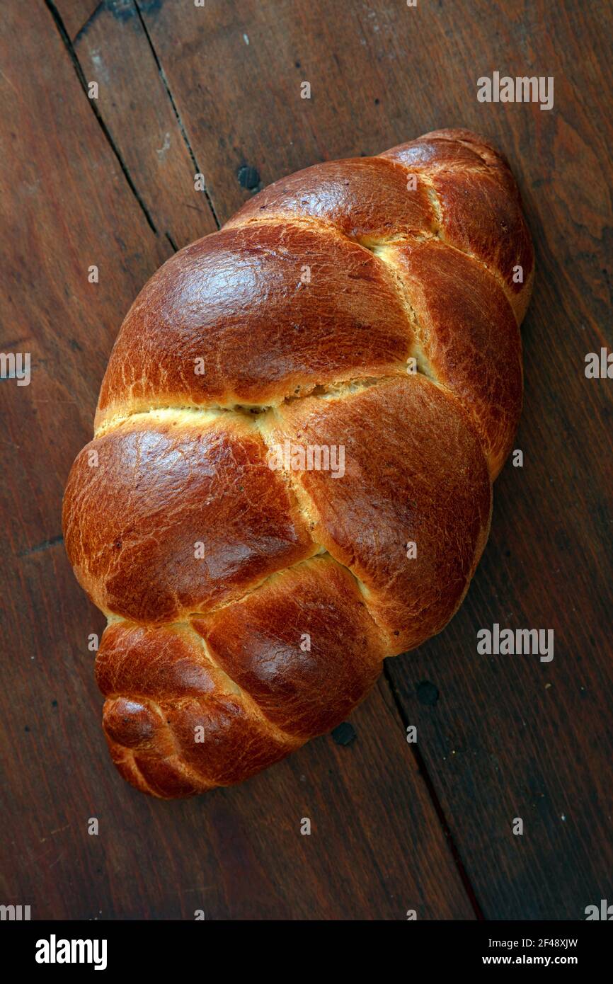 Easter sweet bread, Braided brioche, tsoureki, challah. Loaf on wooden
