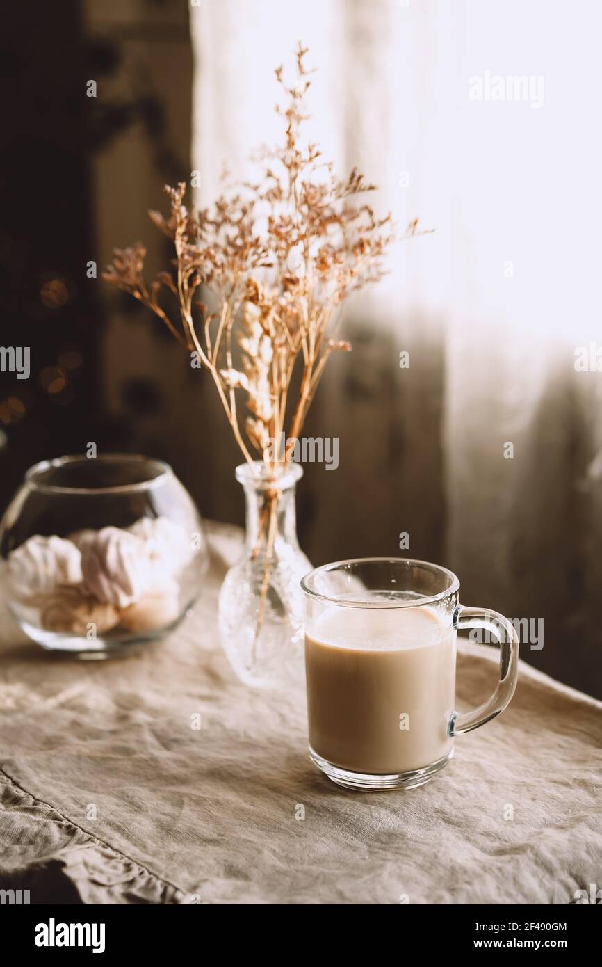 Morning coffee in pastel beige tones. Inviting kitchen. Stock Photo