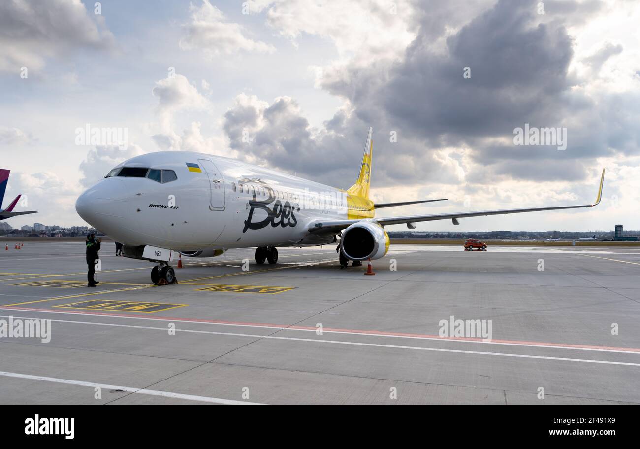 Ukraine, Kyiv - March 19, 2021: Bees Airline plane on the apron. Boeing 737-800 UR-UBA Passenger aircraft. Stock Photo