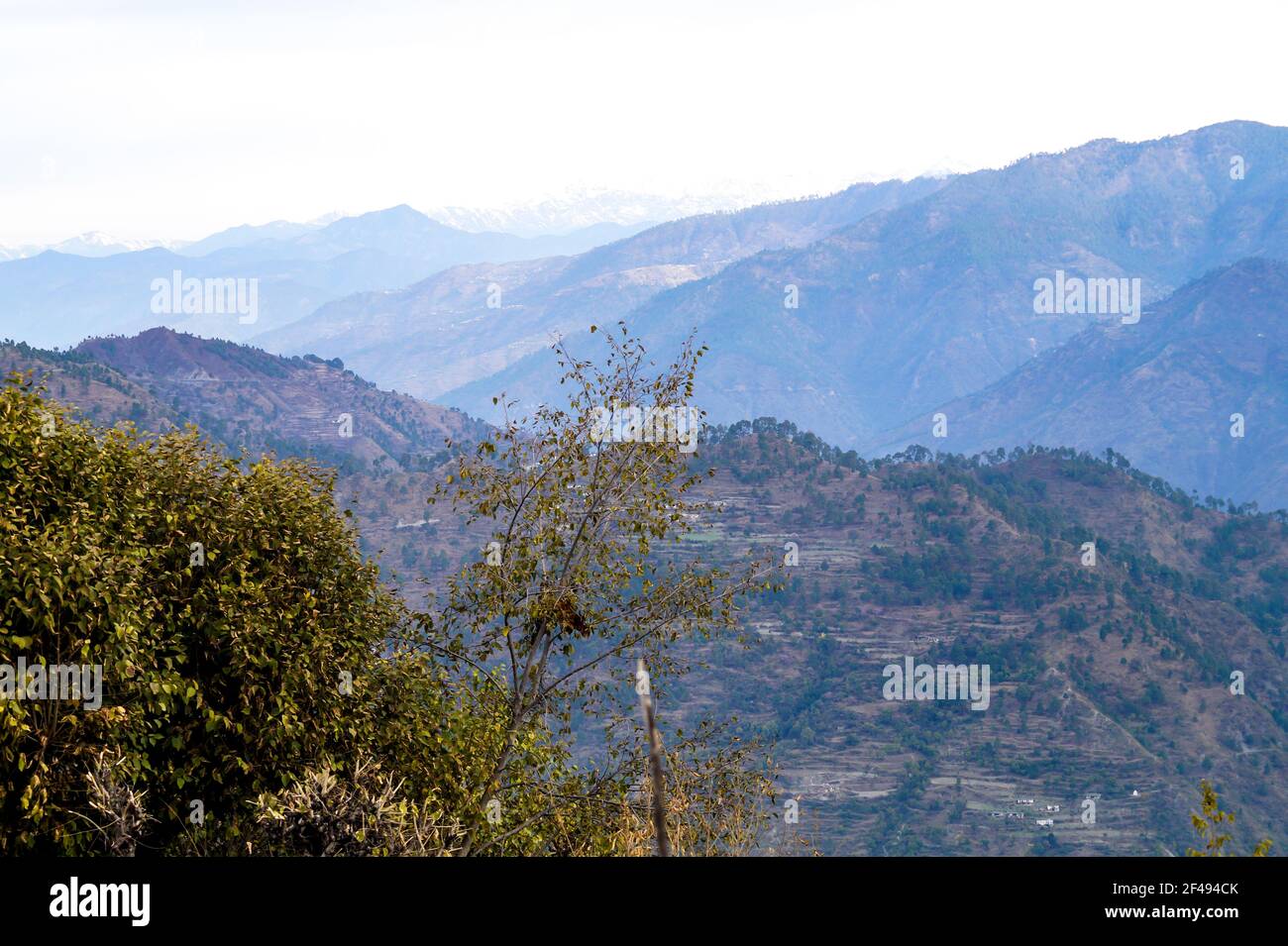 A scenic shot of mountainscape in the light clear sky background Stock Photo