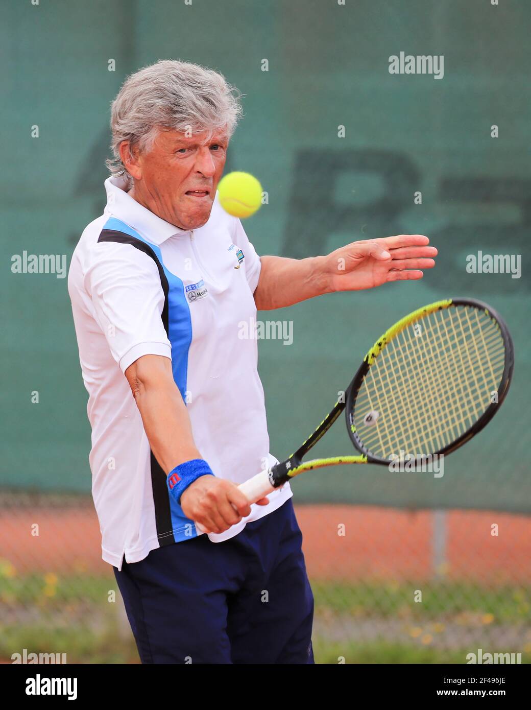 Male tennis player in action at the Munich Senior Open 2020, Men's singles MS70, ITF Seniors Tennis Tournament Stock Photo