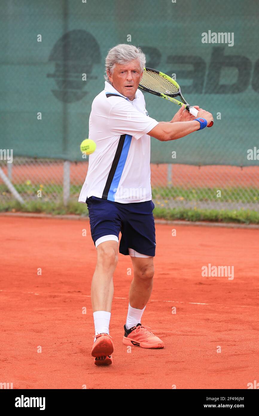 Male tennis player in action at the Munich Senior Open 2020, Men's singles MS70, ITF Seniors Tennis Tournament Stock Photo