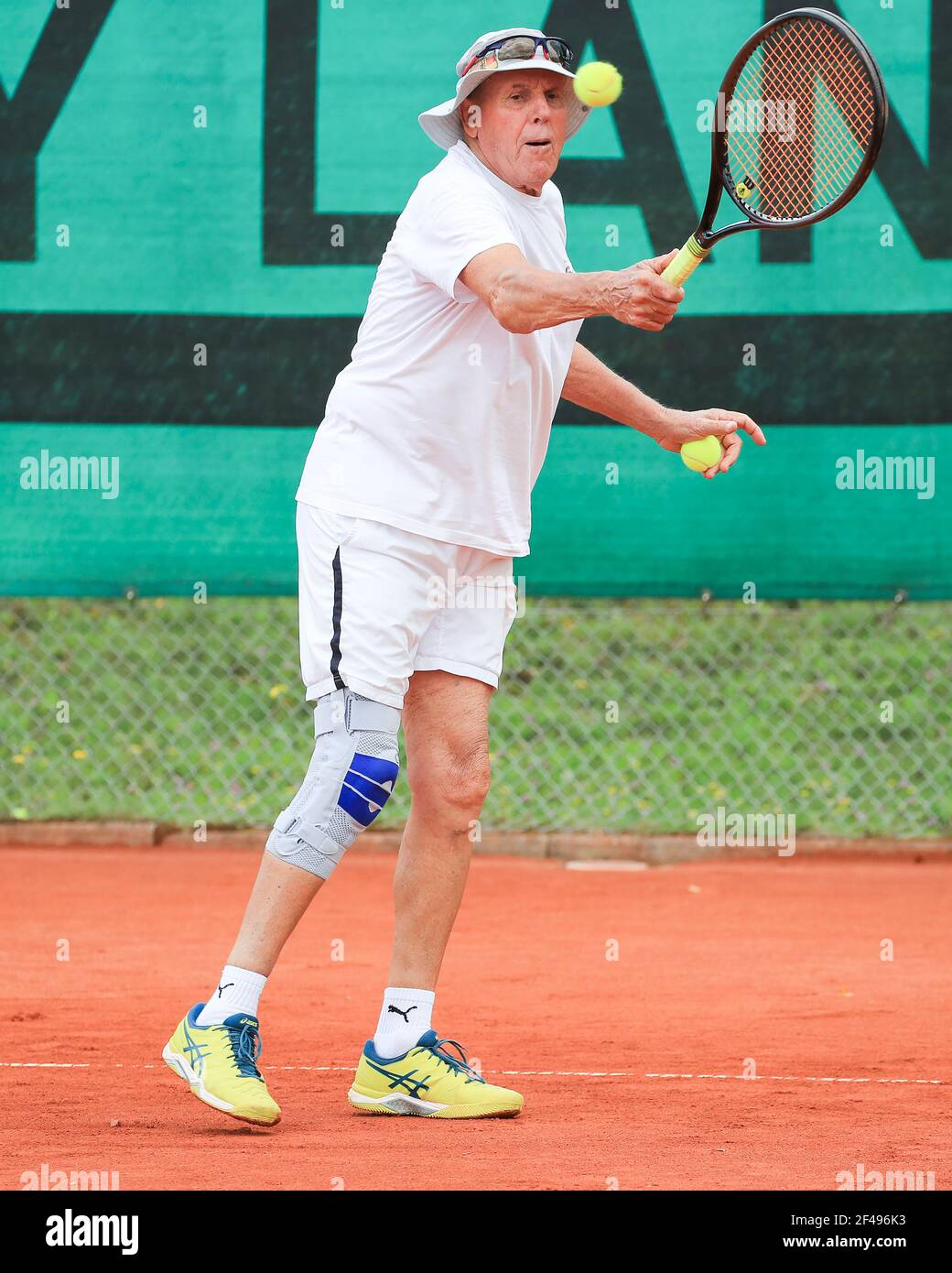 Male tennis player in action at the Munich Senior Open 2020, Men's singles MS80, ITF Seniors Tennis Tournament Stock Photo
