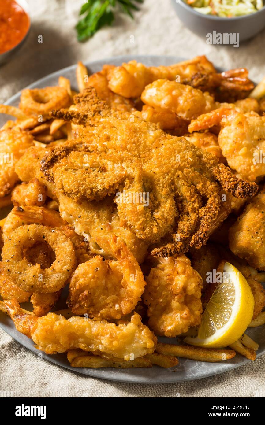 Homemade Deep Fried Seafood Platter with Fries and Tartar Sauce Stock