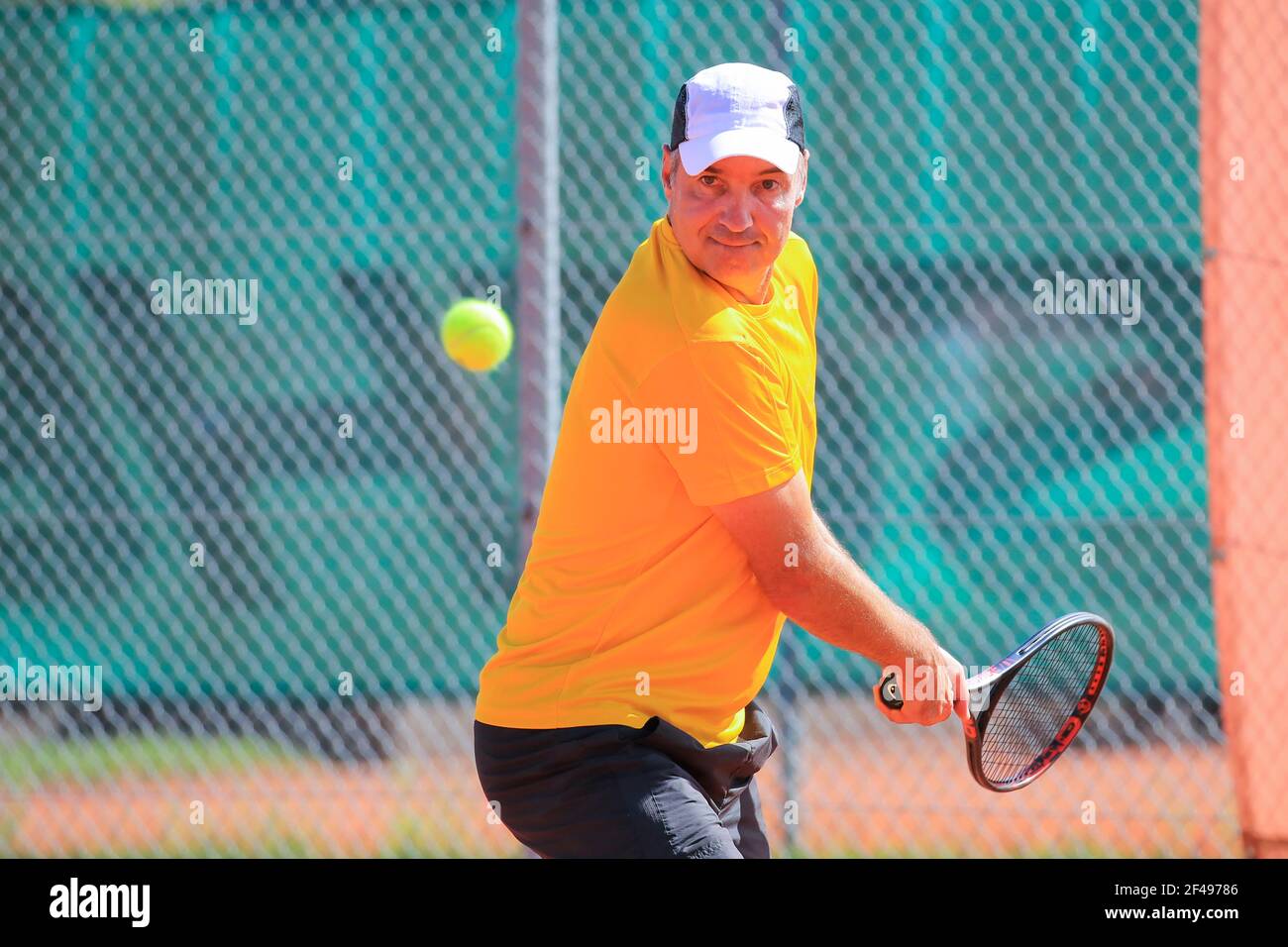Male tennis player in action at the Munich Senior Open 2020, Men's singles MS50, ITF Seniors Tennis Tournament Stock Photo