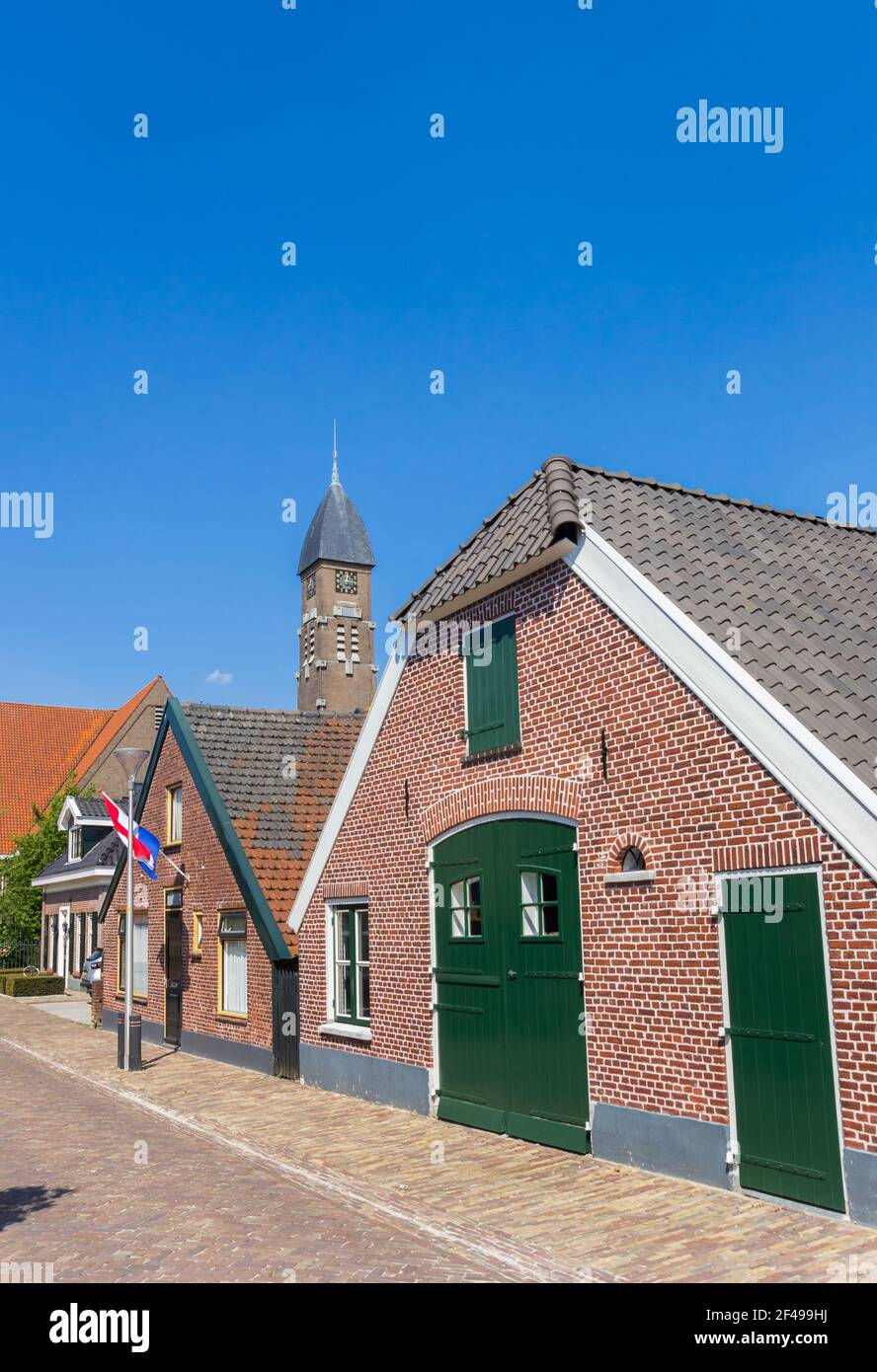 Street with old houses and church tower in Rijssen, Netherlands Stock ...
