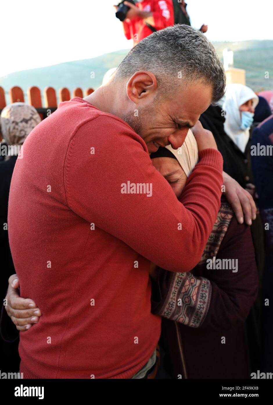 Nablus, Nablus. 19th Mar, 2021. Relatives of Palestinian Atef Yousef Hanaysha mourn during his funeral in the West Bank village of Beit Dajan, east of Nablus, on March 19, 2021. Atef Yousef Hanaysha was shot dead by Israeli soldiers on Friday afternoon in an anti-settlement rally near Beit Dajan village, medics said. Credit: Ayman Nobani/Xinhua/Alamy Live News Stock Photo