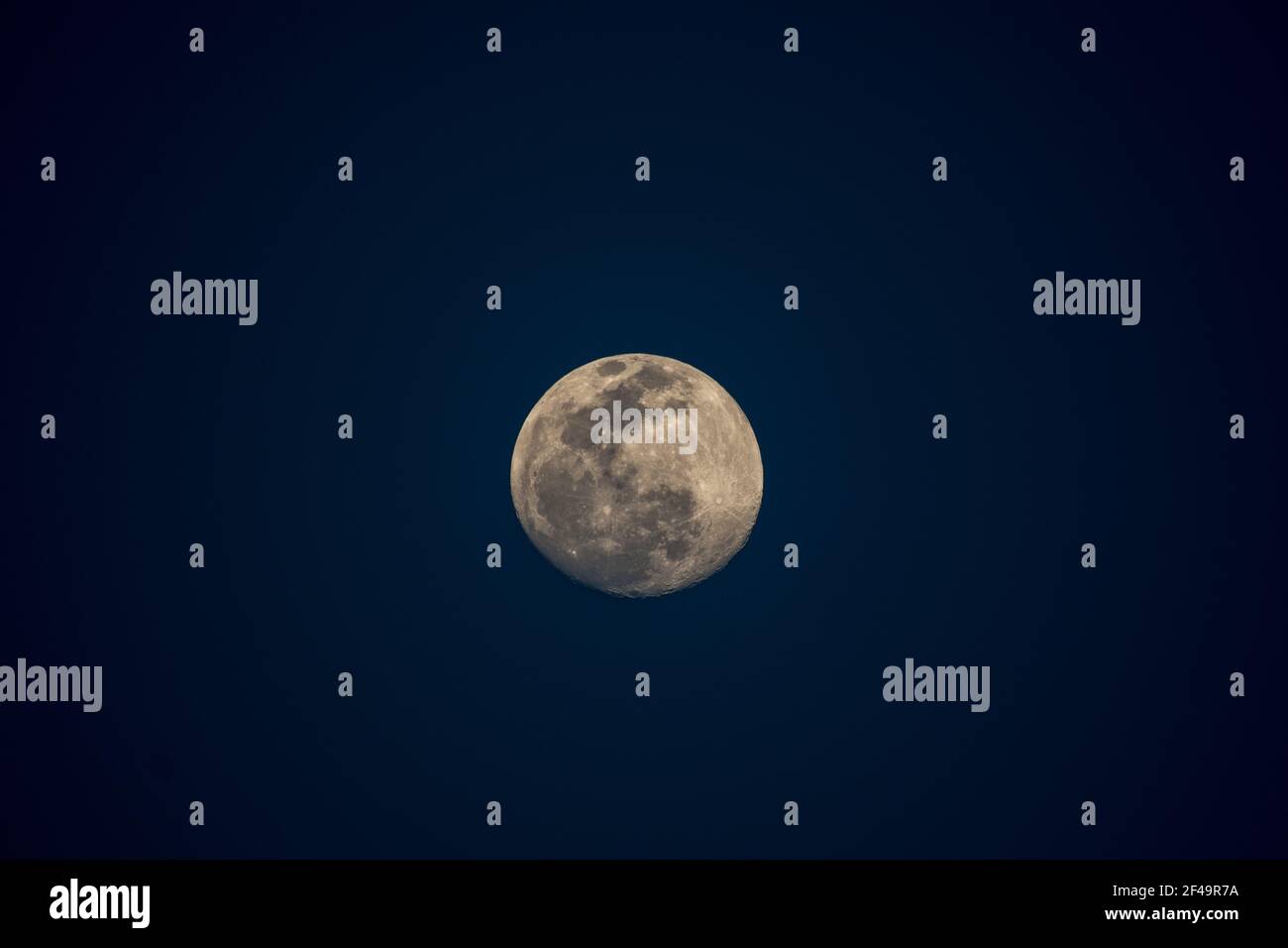 A beautiful shot of the bright full moon isolated in the night sky ...