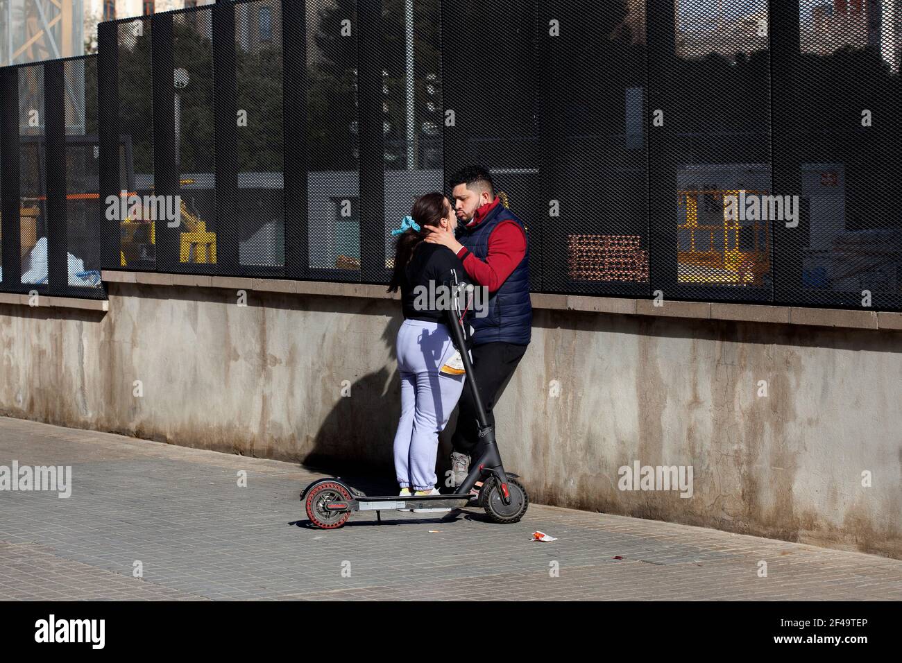 Couple kissing in the street, Barcelona, Spain. Stock Photo