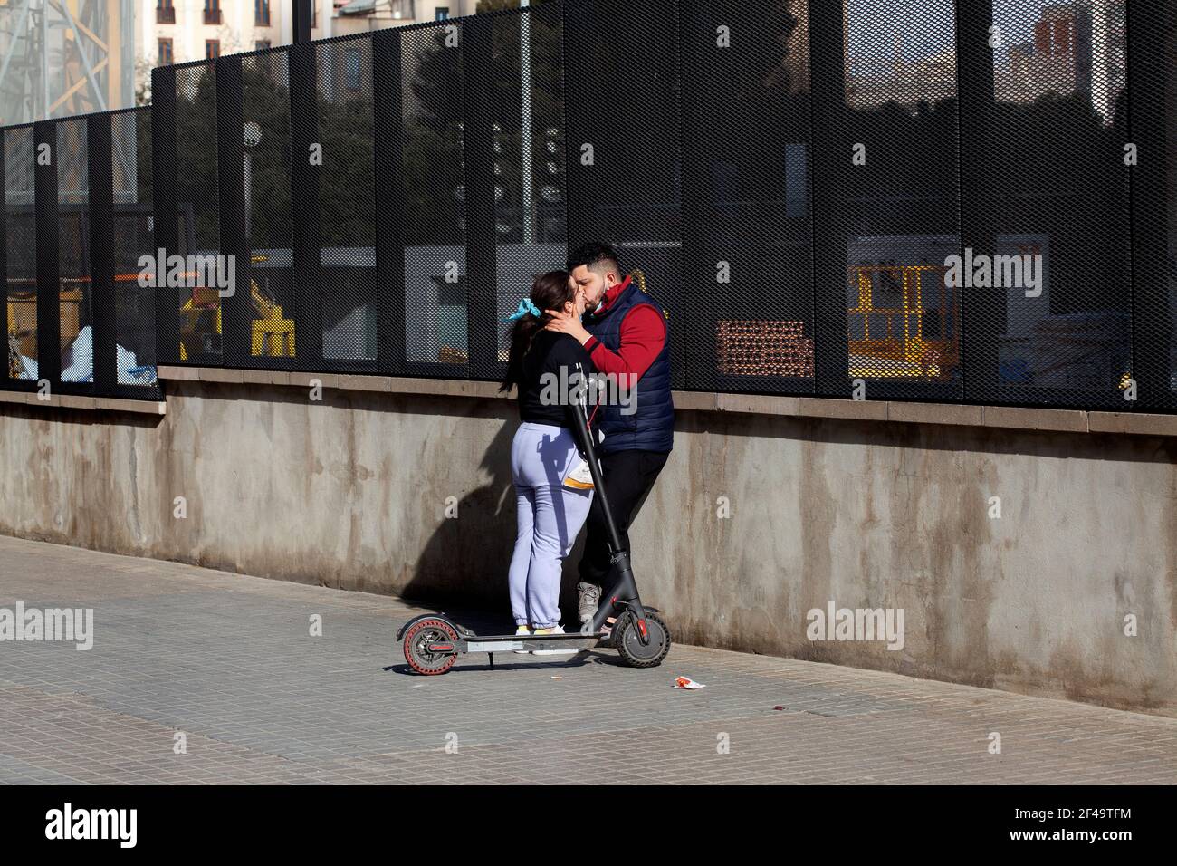 Couple kissing in the street, Barcelona, Spain. Stock Photo