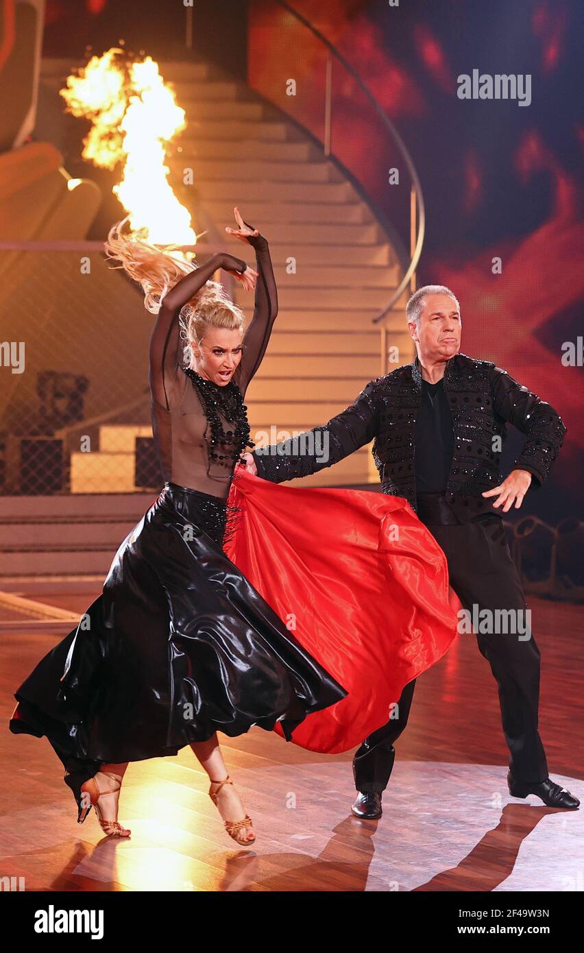 Cologne, Germany. 19th Mar, 2021. Kai Ebel, presenter, and Kathrin Menzinger, professional dancer, dance Paso Doble to You Really Got Me in the third round of the RTL dance show 'Let's Dance'. Credit: Rolf Vennenbernd/dpa/Alamy Live News Stock Photo