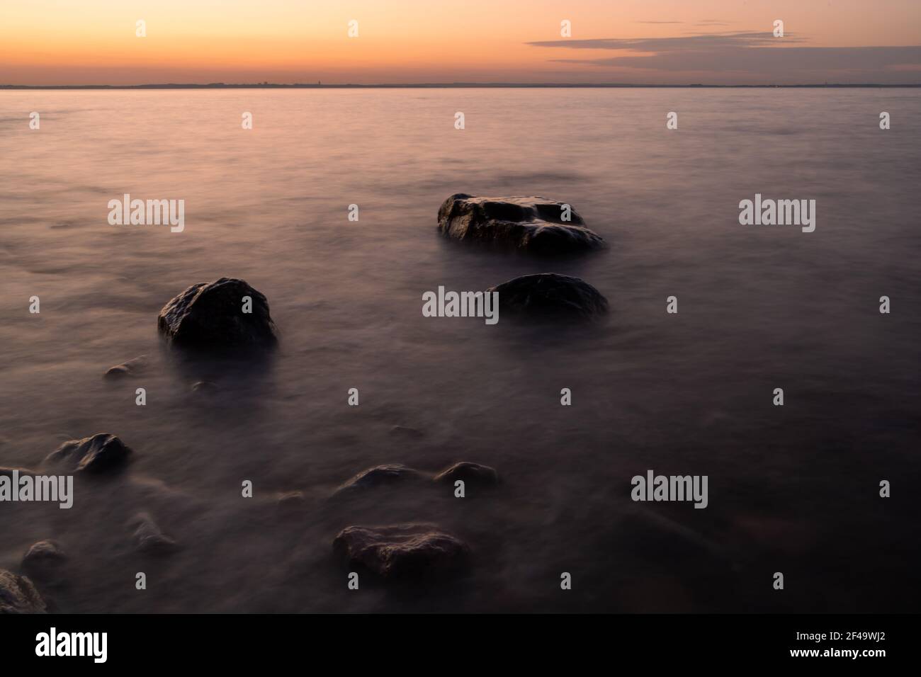 A beautiful view of the stunning sunset sky reflecting on the sea Stock ...