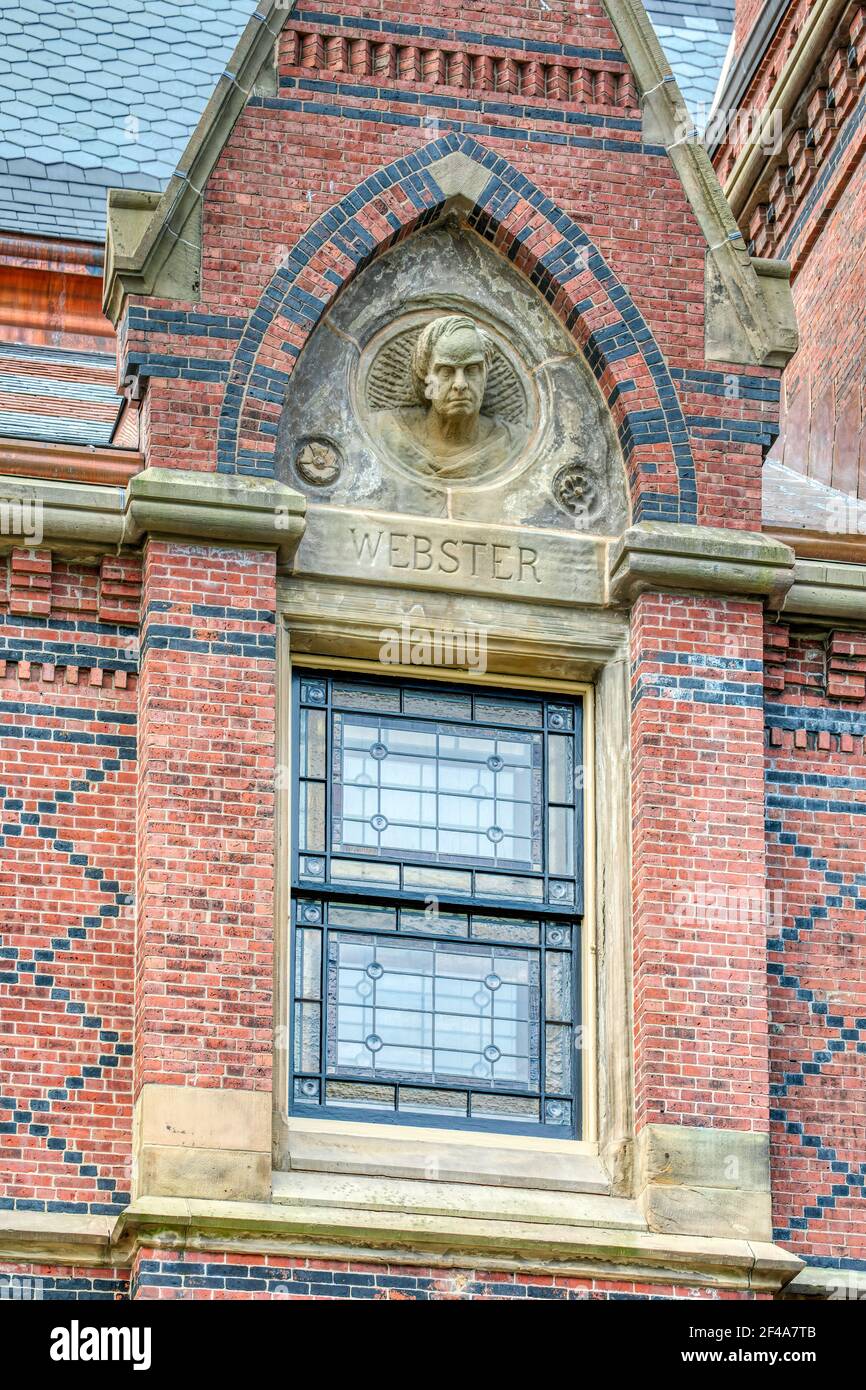 Harvard University's Memorial Hall depicts great orators (Webster here) at its east (Sanders Theater) end, on Quincy Street in Cambridge, Mass. Stock Photo