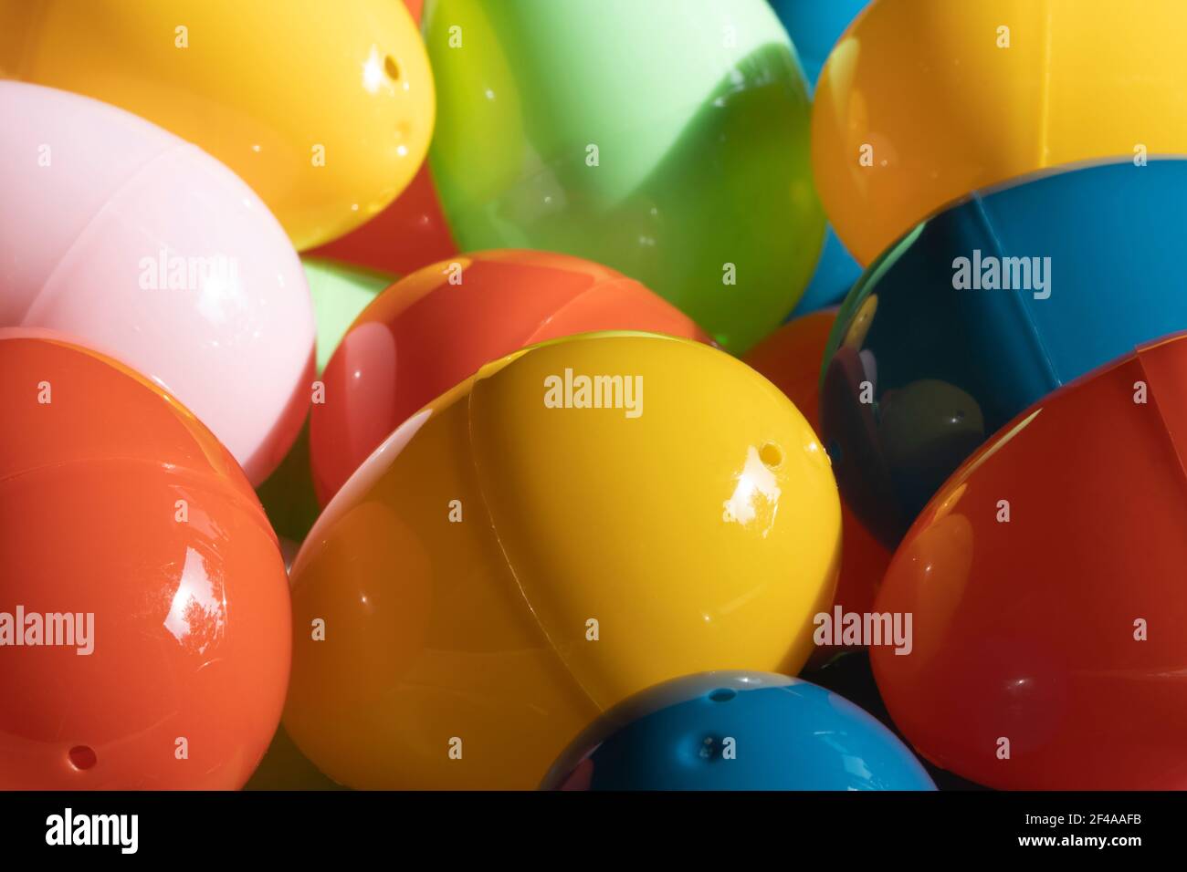Colorful plastic Easter eggs in the sun. Stock Photo