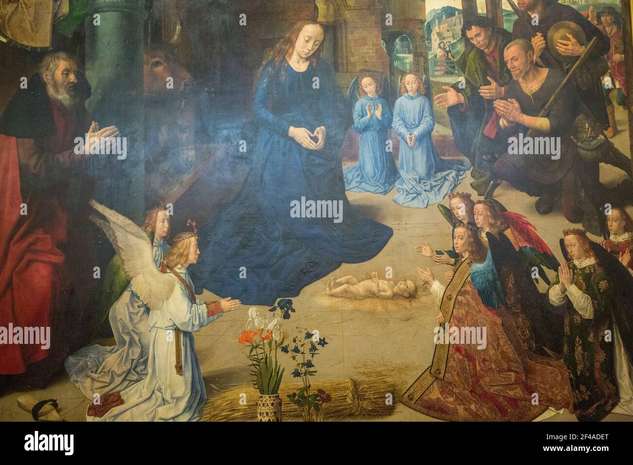Florence, Italy.  'Adoration of the Shepherds with angels and SS. Thomas Apostle, Anthony, Margaret, Mary Magdelen and portraits of the Portinari fami Stock Photo