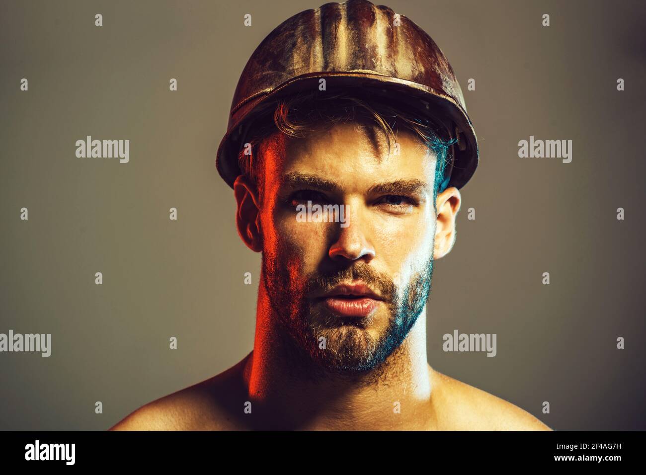 Portrait of handsome engineer. Construction worker in hardhat. Business, industry, technology - builder concept. Stock Photo