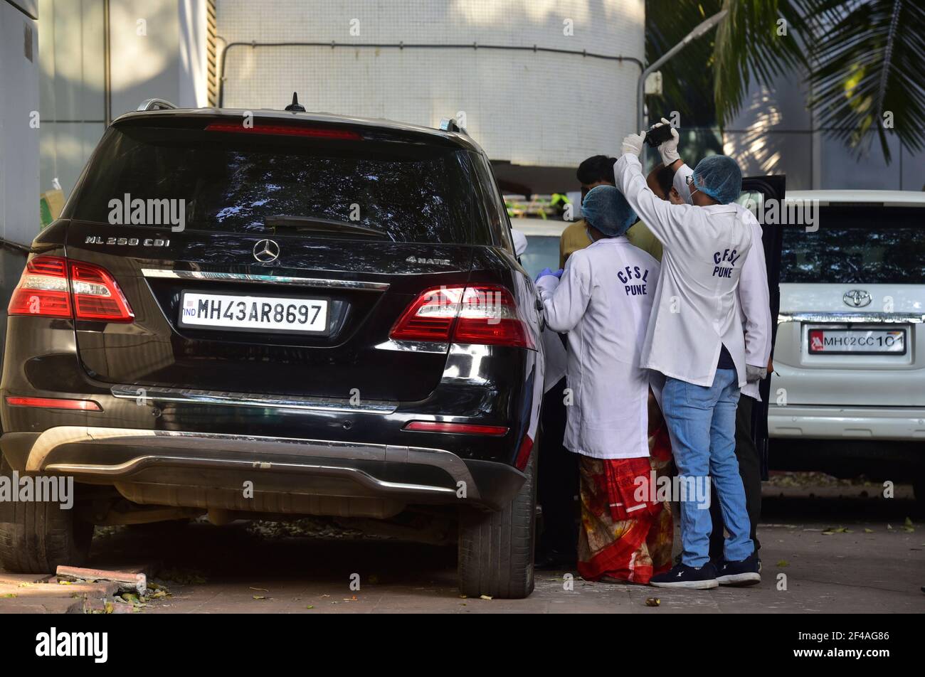 MUMBAI, INDIA - MARCH 19: A team from Pune Forensic Science Laboratory (FSL) investigating a vehicle seized in the Sachin Vaze case, at NIA office Peddar Road on March 19, 2021 in Mumbai, India. Forensics team from Pune to conduct specialised tests on the 6 cars seized by the NIA in the past few days, including a SUV Scorpio, 2 Mercedes, a Toyota Land Cruiser Prado and other models. Triggering a massive political furore, the SUV Scorpio was found abandoned outside Antilia, the home of industrialist Mukesh Ambani, along with 20 gelatin sticks and a threat note, which the NIA claims Vaze was usi Stock Photo