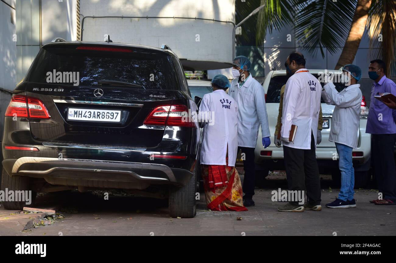 MUMBAI, INDIA - MARCH 19: A team from Pune Forensic Science Laboratory (FSL) investigating a vehicle seized in the Sachin Vaze case, at NIA office Peddar Road on March 19, 2021 in Mumbai, India. Forensics team from Pune to conduct specialised tests on the 6 cars seized by the NIA in the past few days, including a SUV Scorpio, 2 Mercedes, a Toyota Land Cruiser Prado and other models. Triggering a massive political furore, the SUV Scorpio was found abandoned outside Antilia, the home of industrialist Mukesh Ambani, along with 20 gelatin sticks and a threat note, which the NIA claims Vaze was usi Stock Photo