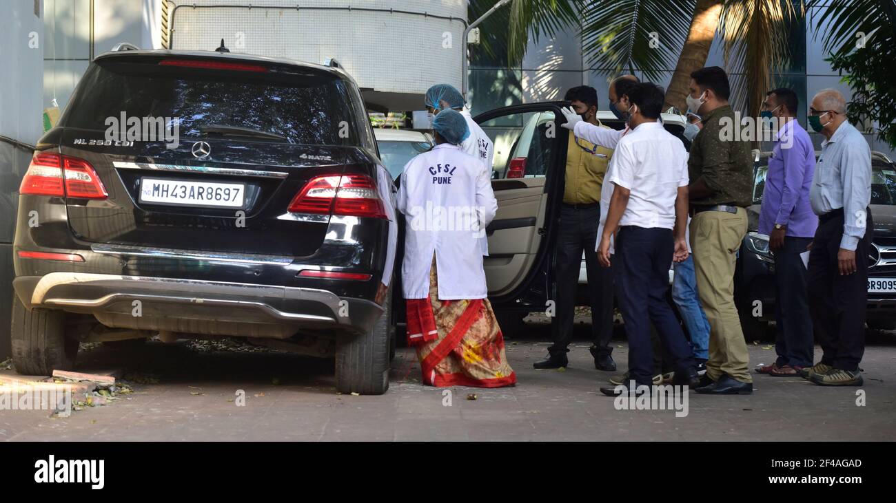 MUMBAI, INDIA - MARCH 19: A team from Pune Forensic Science Laboratory (FSL) investigating a vehicle seized in the Sachin Vaze case, at NIA office Peddar Road on March 19, 2021 in Mumbai, India. Forensics team from Pune to conduct specialised tests on the 6 cars seized by the NIA in the past few days, including a SUV Scorpio, 2 Mercedes, a Toyota Land Cruiser Prado and other models. Triggering a massive political furore, the SUV Scorpio was found abandoned outside Antilia, the home of industrialist Mukesh Ambani, along with 20 gelatin sticks and a threat note, which the NIA claims Vaze was usi Stock Photo