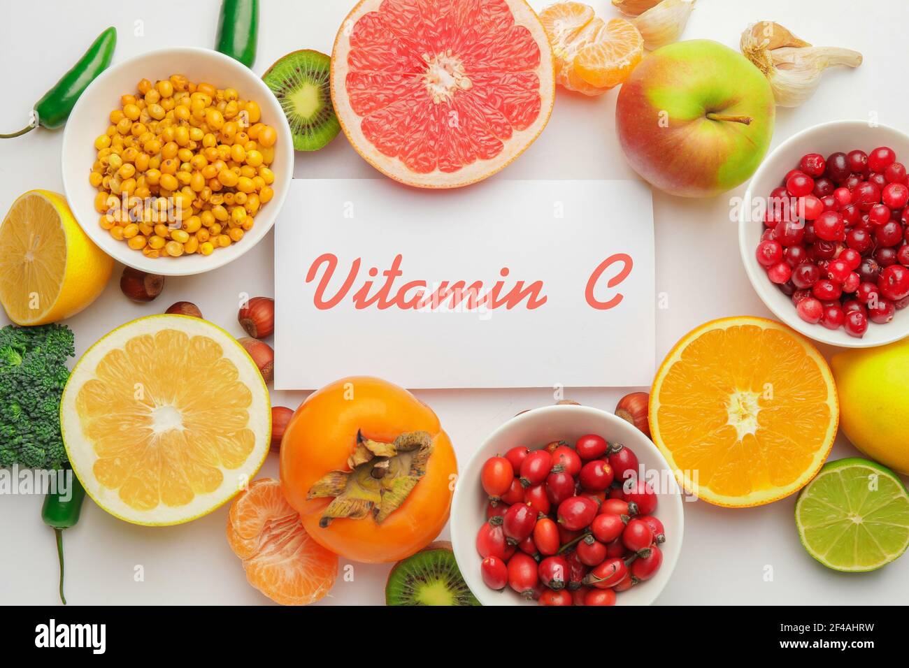 Healthy products rich in vitamin C on white background Stock Photo - Alamy