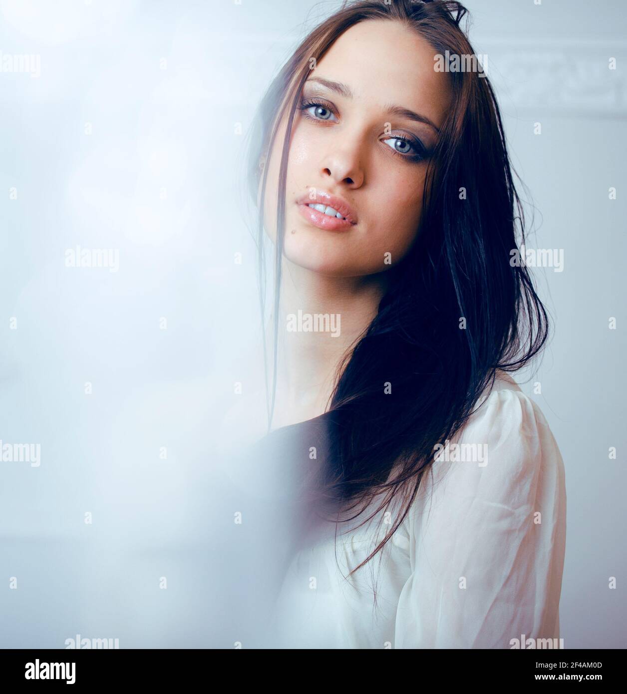 young pretty brunette woman smiling happy on white background smooth ...