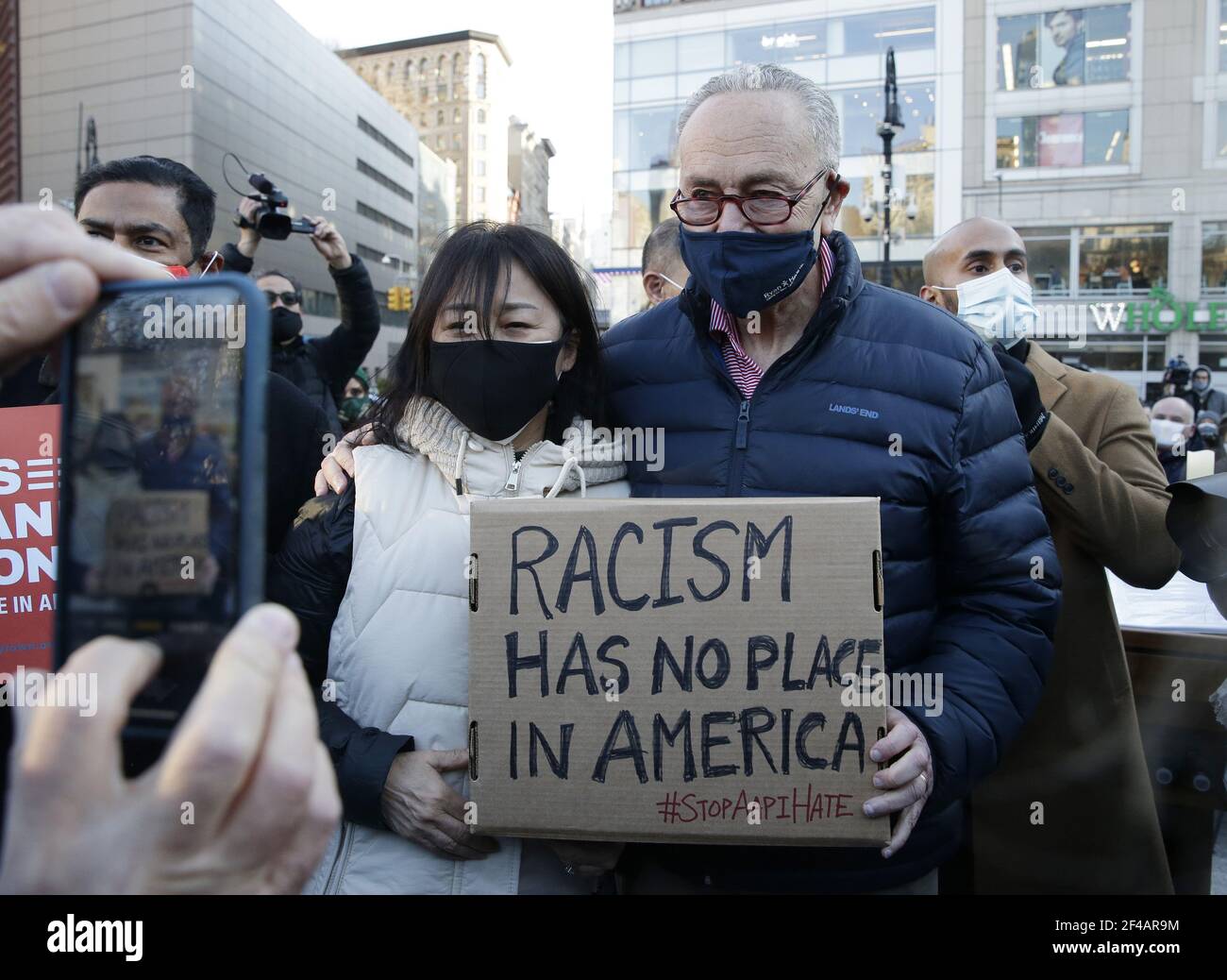 New York, United States. 19th Mar, 2021. Sen. Chuck Schumer holds up a sign that says Racism Has No Place In America at a Vigil for Peace organized by Asian American Federation in Union Square in New York City on Friday, March 19, 2021. President Biden on Friday urged Congress to pass hate crime legislation to address the increase in discrimination and violence against Asian Americans during the COVID-19 pandemic. Photo by John Angelillo/UPI Credit: UPI/Alamy Live News Stock Photo