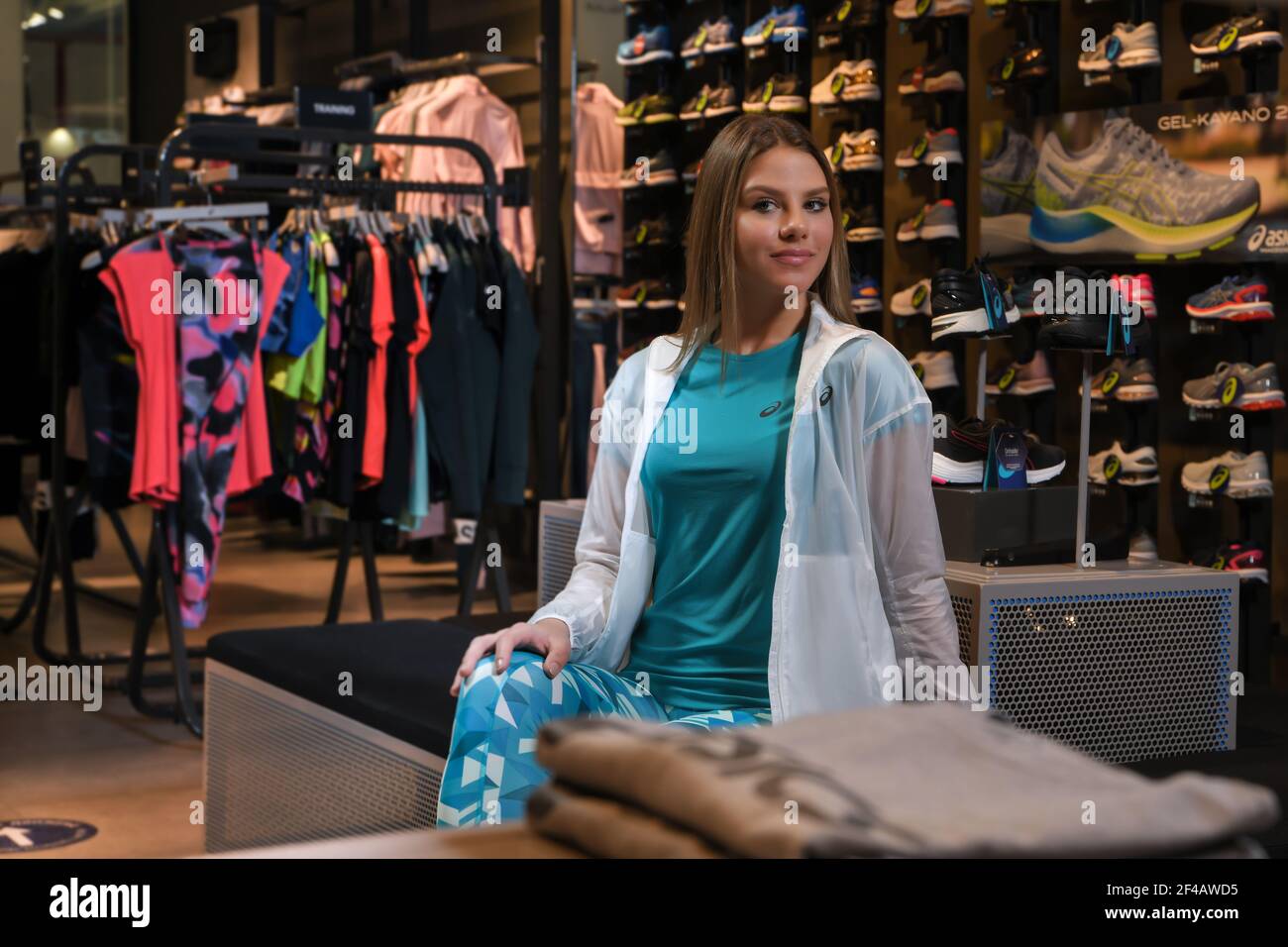 Skopje, Northern Macedonia - March 12, 2021: Asics store in Skopje,  Northern Macedonia. Girl photo model dressed in sportswear and sneakers  ASICS GEL Stock Photo - Alamy