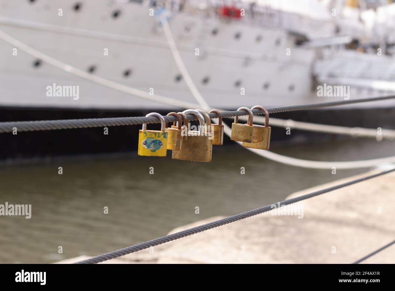 Old love padlocks by the river. Stock Photo