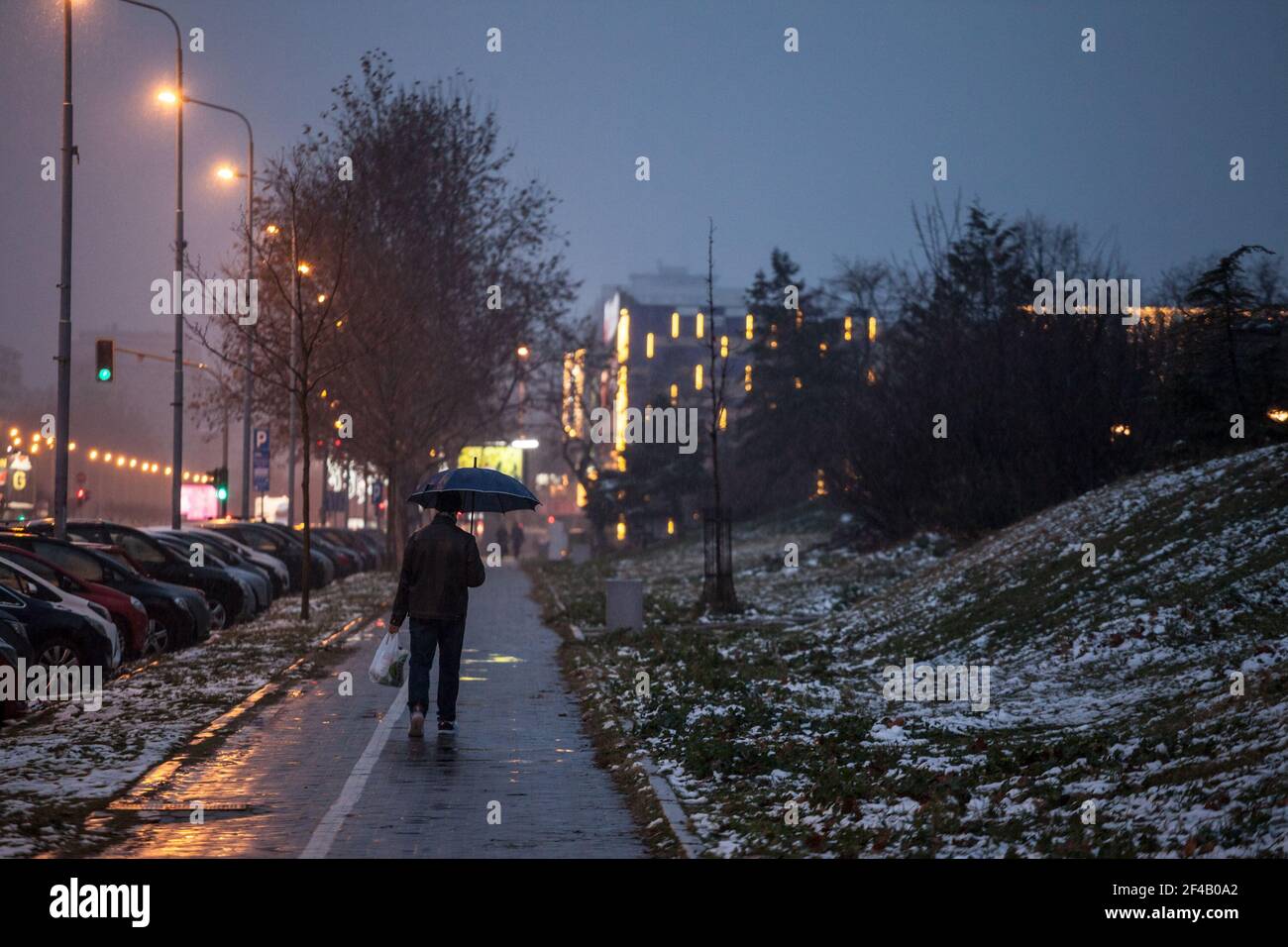 BELGRADE, SERBIA JANUARY 10, 2021Man walking alone in the streets of Novi beograd with an