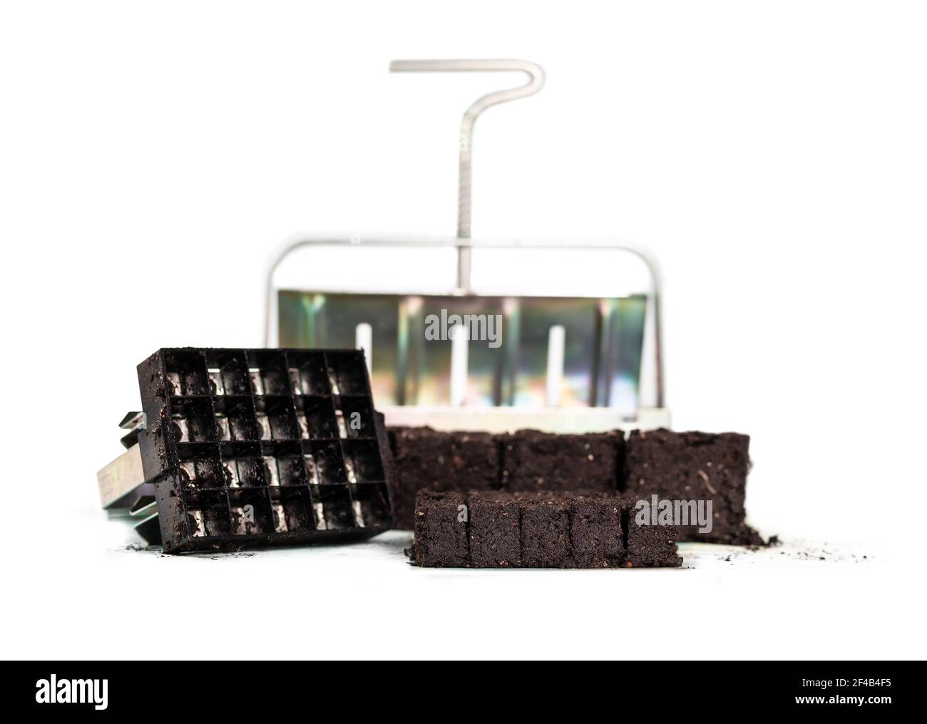 Handheld soil block maker in 2 sizes with compressed potting soil